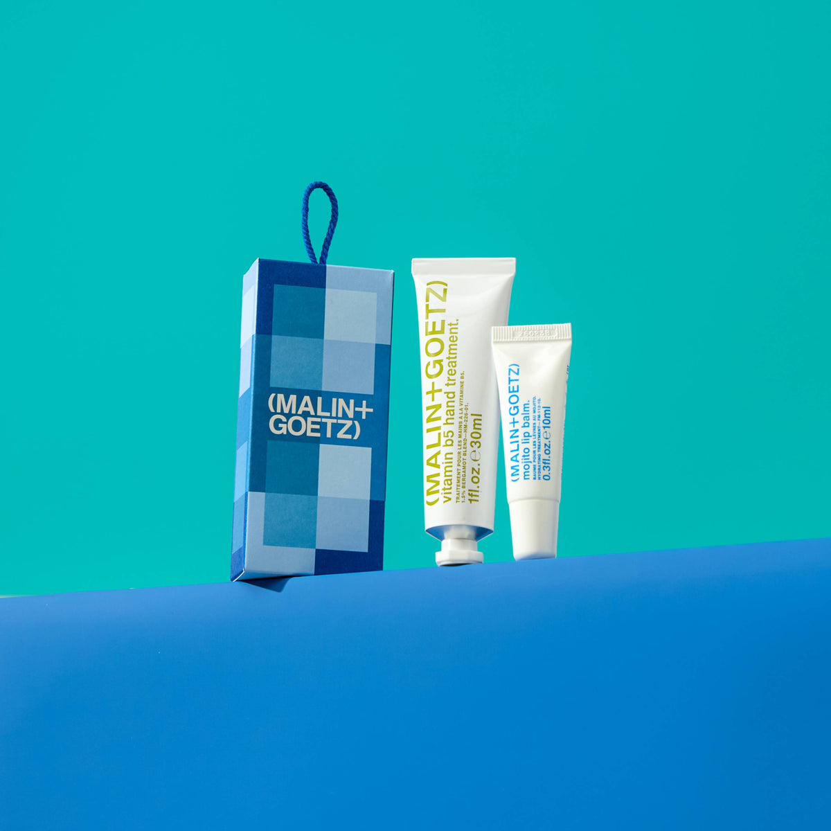in good hands holiday set contains vitamin b5 hand treatment. 1 fl. oz. / 30ml and mojito lip balm. 0.3 fl. oz. / 10 ml